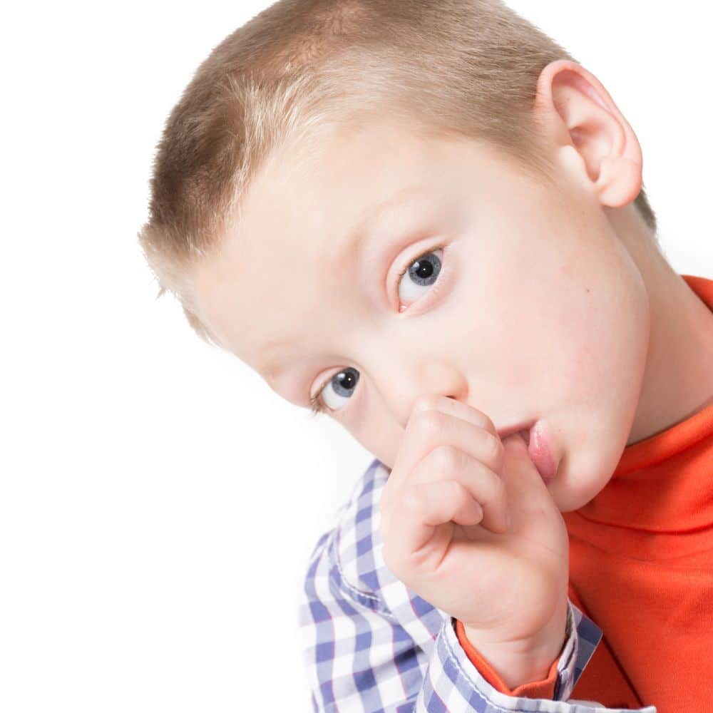 Young boy sucking his thumb