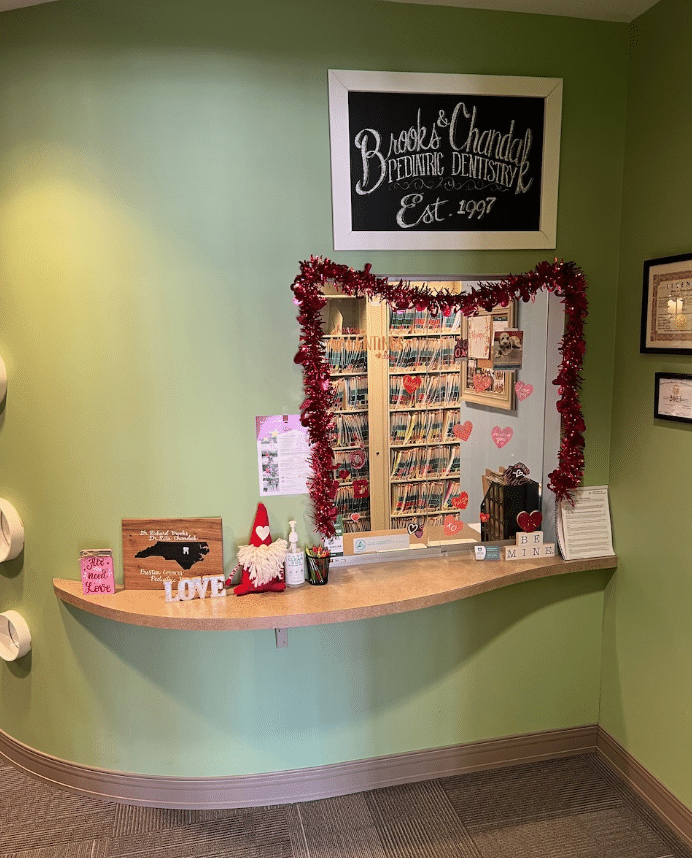 The modern and child-friendly reception area of Preston Corners Pediatric Dentistry in Cary, NC.